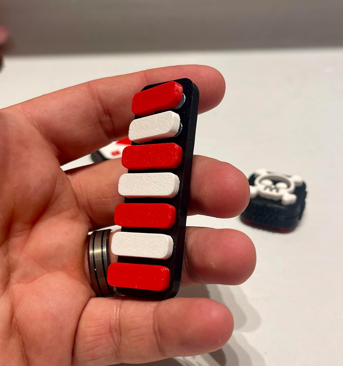 DeadHand Skull & Ace Fidget Slider with Snap Piano Set, Gaming-themed Desk Toy, Red and White